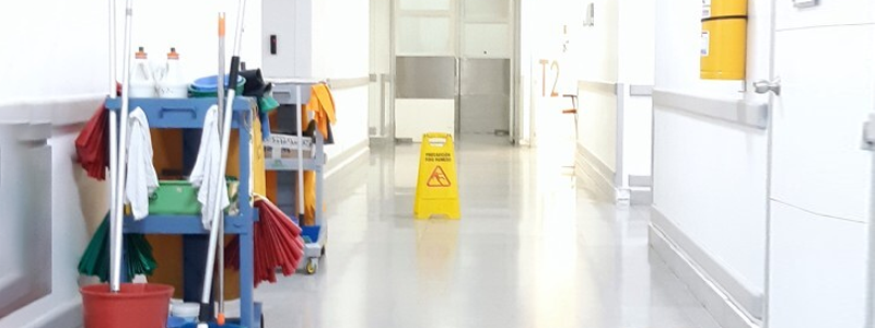 A hospital corridor with cleaning equipment