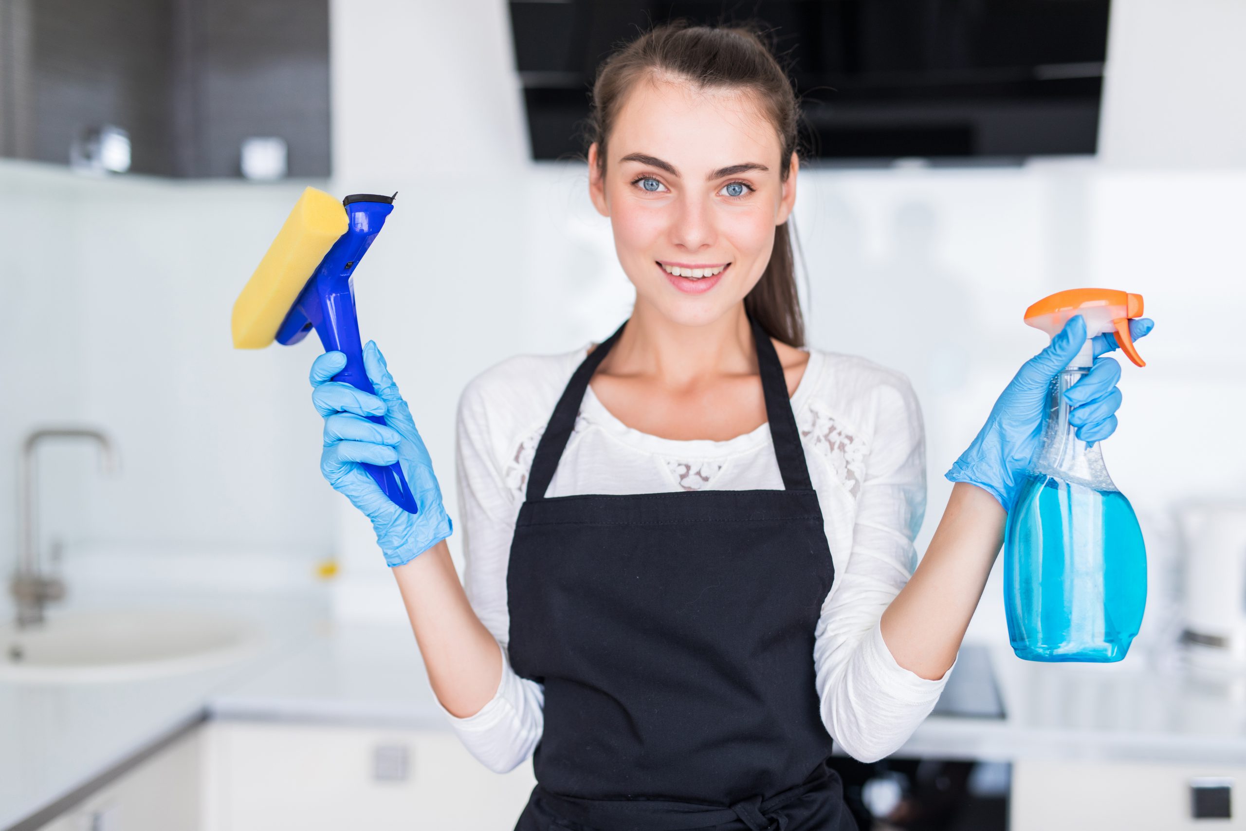 cleaning-concept-young-woman-holding-cleaning-tools-kitchen